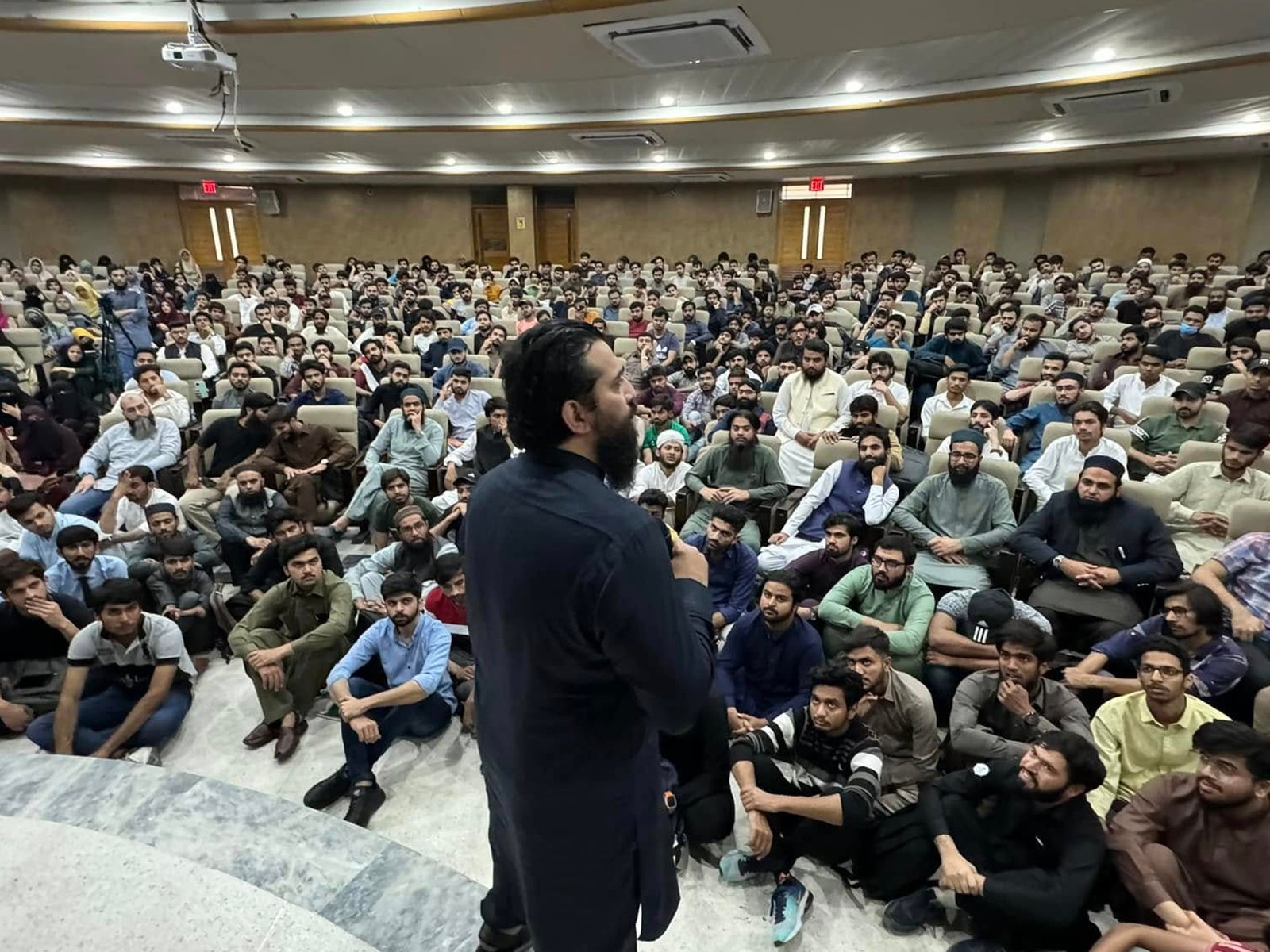 Speaker delivering motivational talk to university students in Lahore