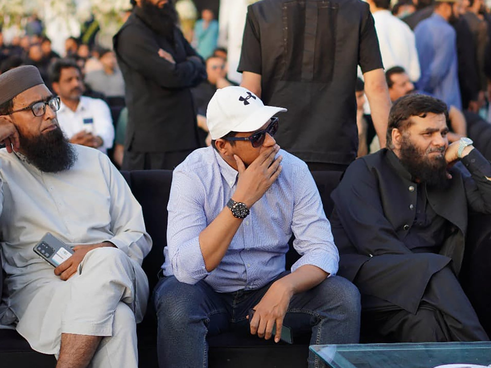 Chief guest or VIP seated, preparing to speak at the ceremony in Lahore
