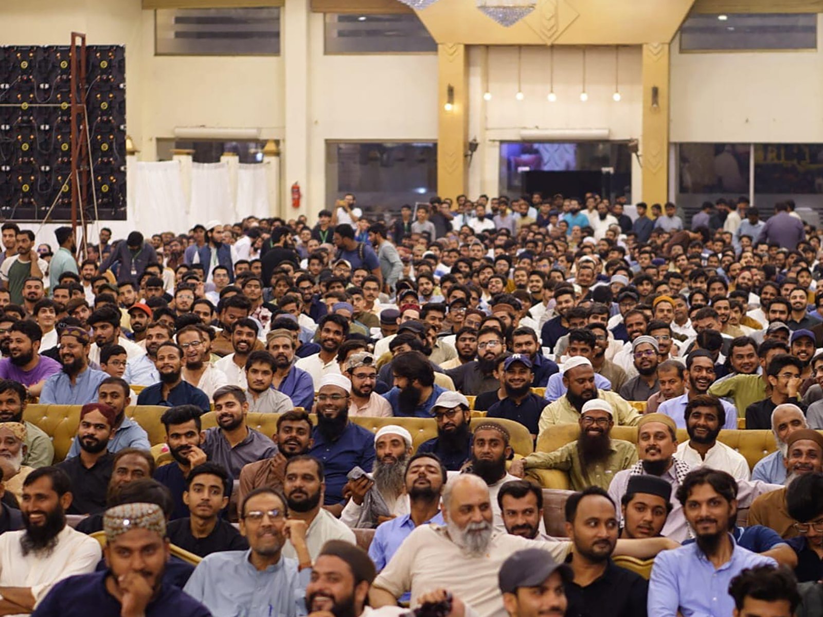 Front view of packed audience in grand Hyderabad event