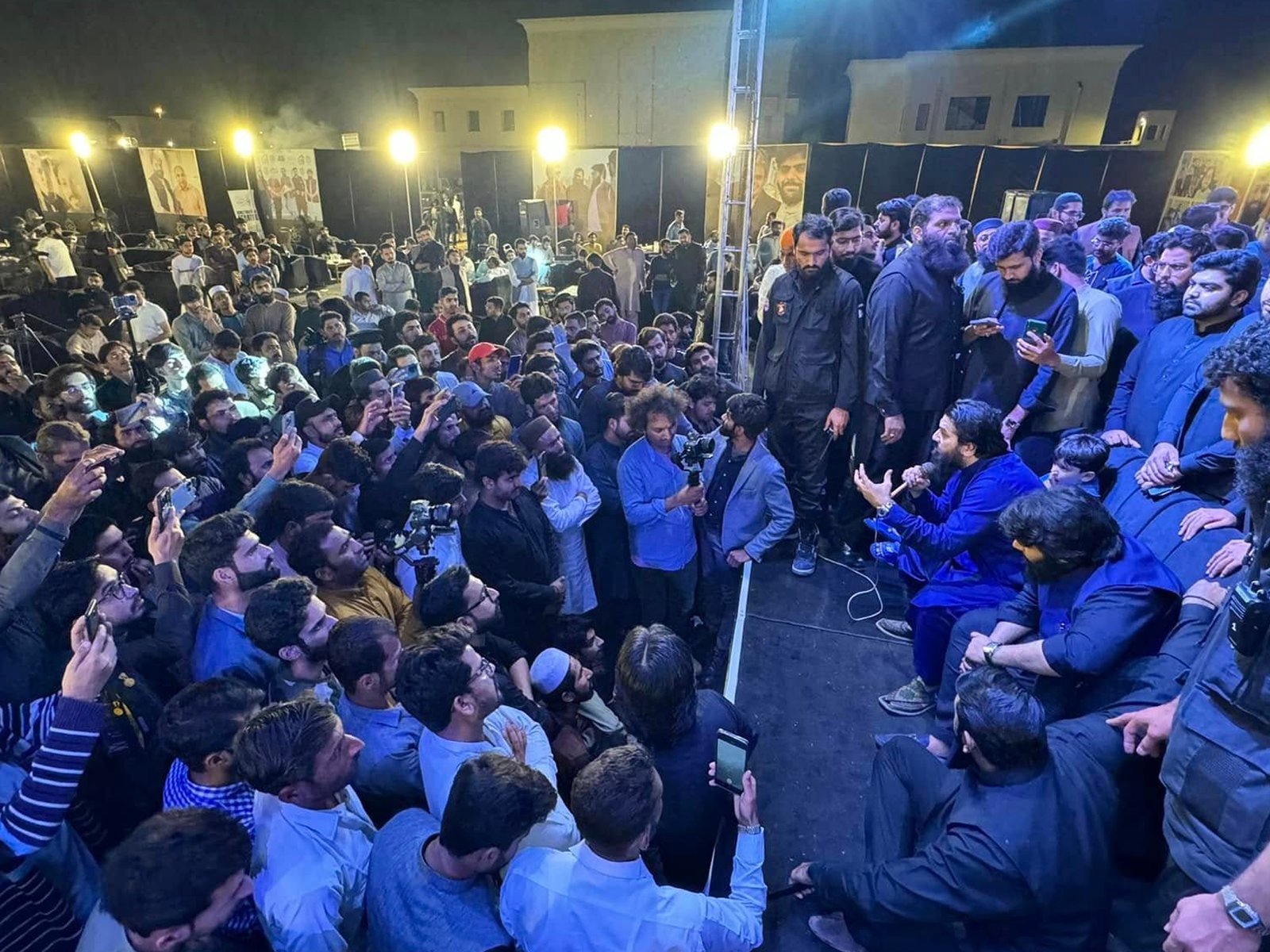 Large crowd captured under blue event lighting at the launch ceremony of Punjab’s tallest building