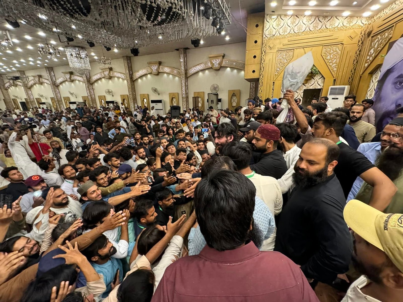 Guest interacting closely with attendees at Hyderabad conference