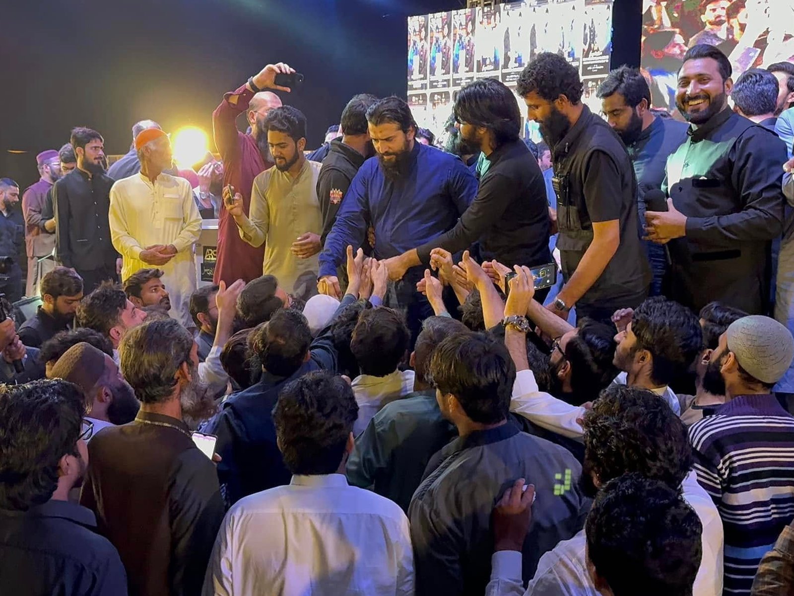 Excited crowd welcoming the chief guest during the launch ceremony in Lahore