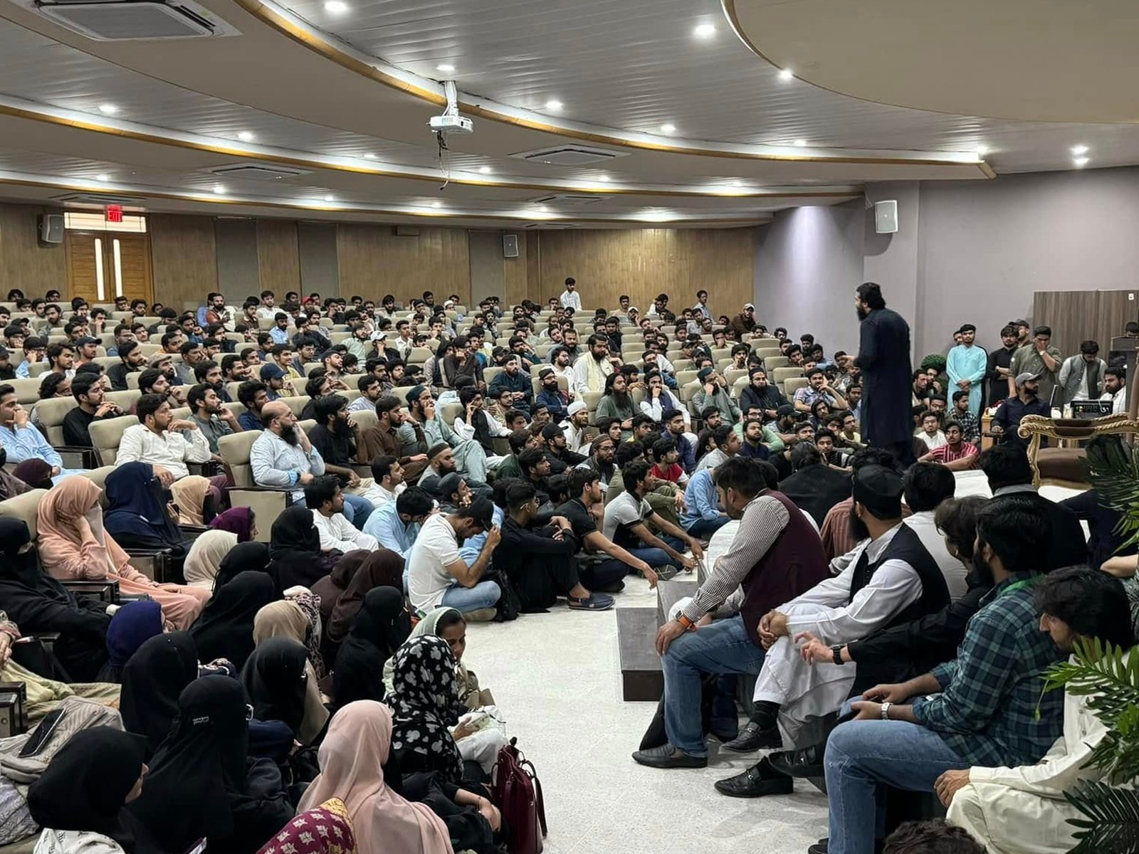 Young students attentively listening during the Youth Empowerment Session at University of Lahore