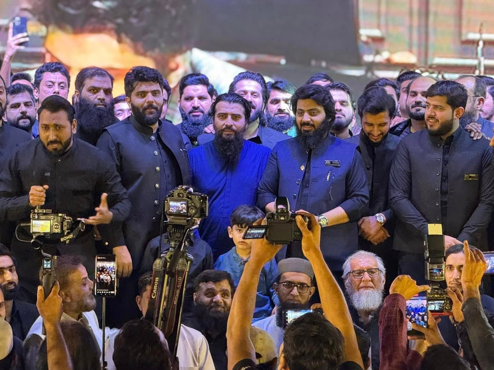 Group photo with youth attendees during the Pearl One Courtyard milestone event