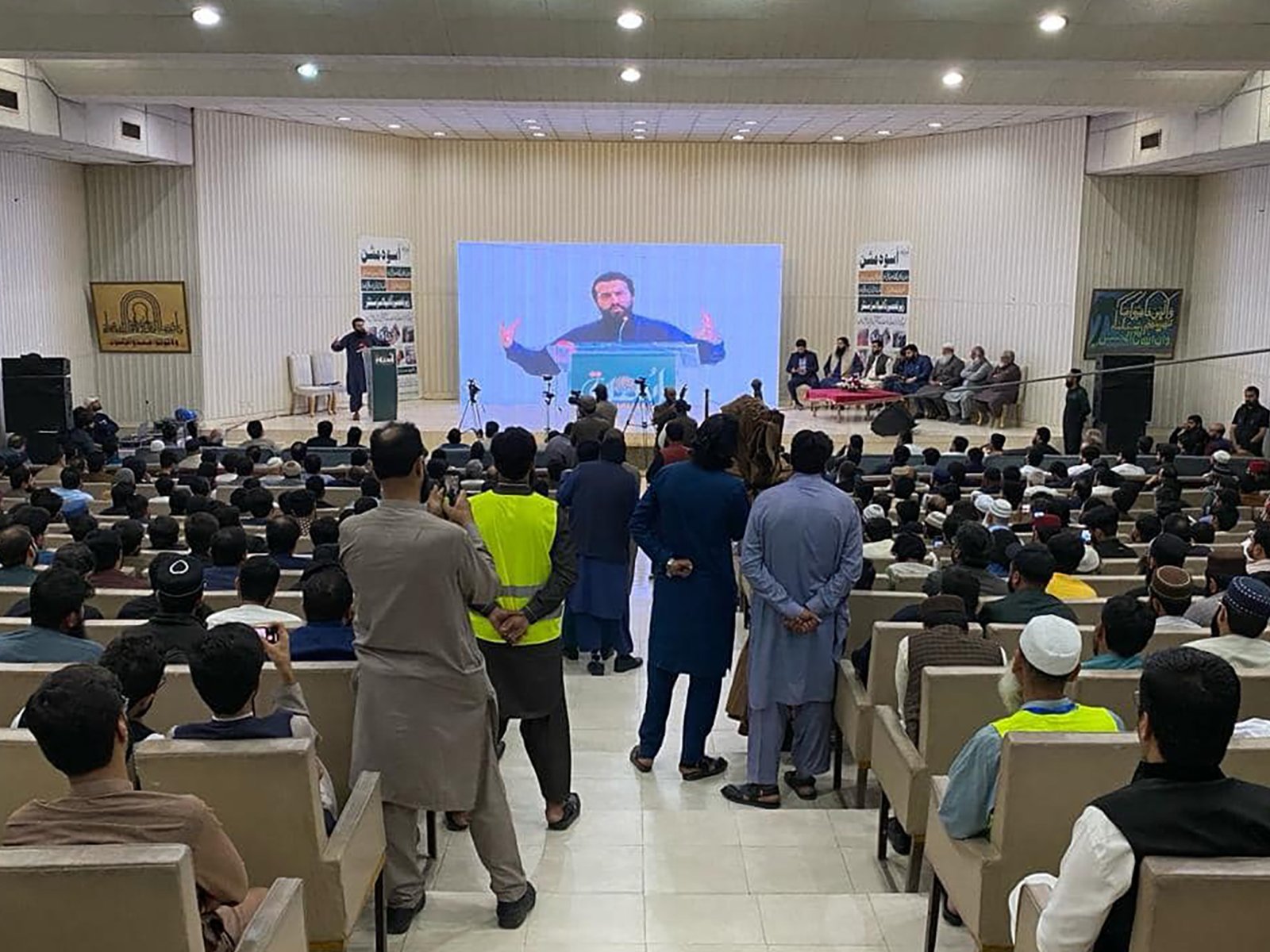 Wide-angle view of audience seated during Uswah Program hosted at Punjab University