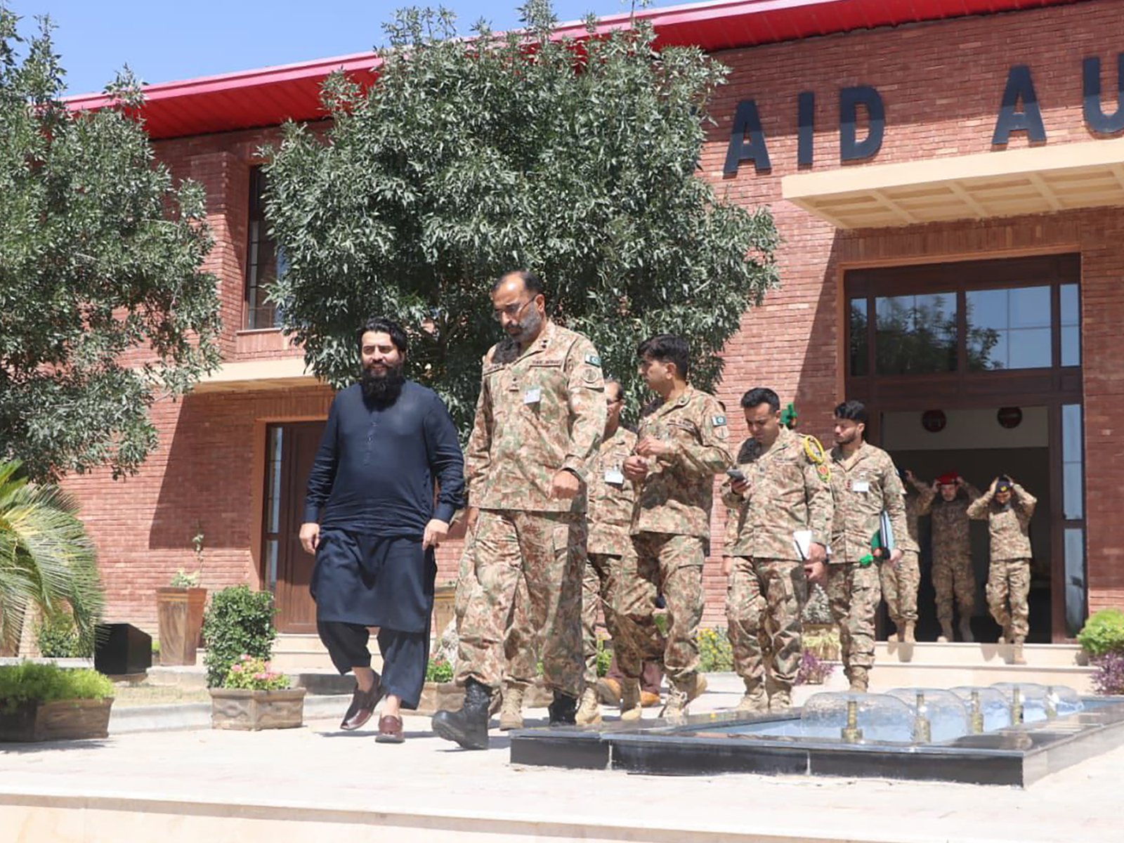 Line of army officers gathered outside the event venue